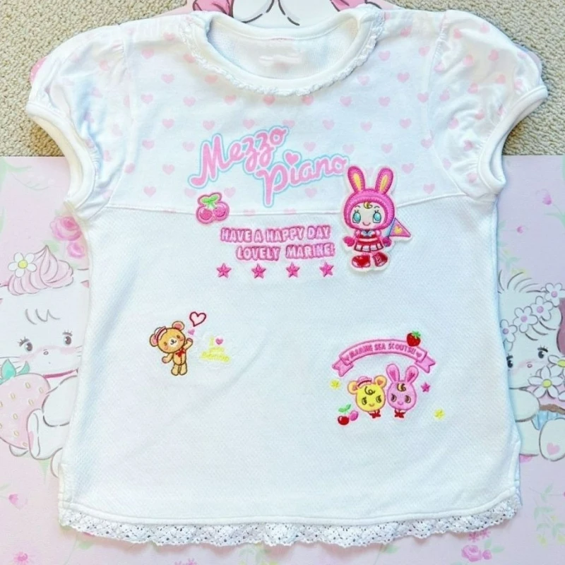 Японская футболка Kawaii Lolita, летняя женская футболка с круглым вырезом и коротким рукавом, милый укороченный топ с аниме-принтом Y2k, эстетичная белая футболка Fairy Grunge
Японская футболка Kawaii Lolita, летняя женская футболка с круглым вырезом и коротким рукавом, милый укороченный топ с аниме-принтом Y2k, эстетичная белая футболка Fairy Grunge