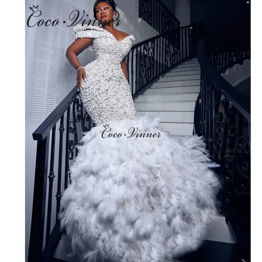 Customized Big Pearls Beaded Mermaid Wedding Dress 2026 New Feather Ruffles Lace Up Back Plus Size Fashion Wedding Dresses W1512
Customized Big Pearls Beaded Mermaid Wedding Dress 2026 New Feather Ruffles Lace Up Back Plus Size Fashion Wedding Dresses W1512