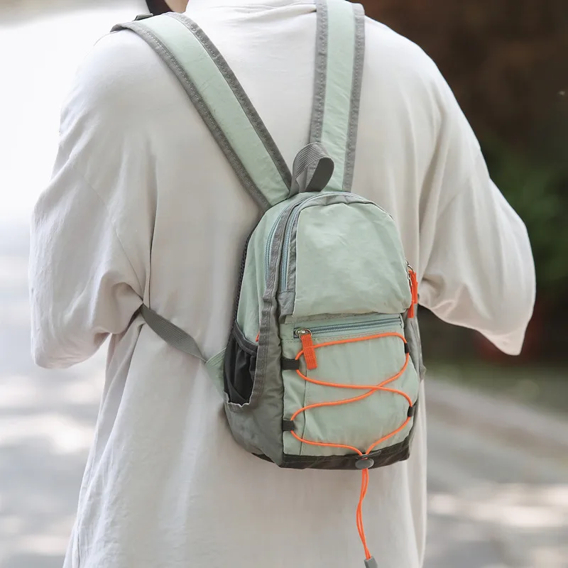 Легкая повседневная уличная походная нейлоновая ткань вместо молодежной дорожной сумки, пригородная сумка на молнии, чистый цвет
Легкая повседневная уличная походная нейлоновая ткань вместо молодежной дорожной сумки, пригородная сумка на молнии, чистый цвет