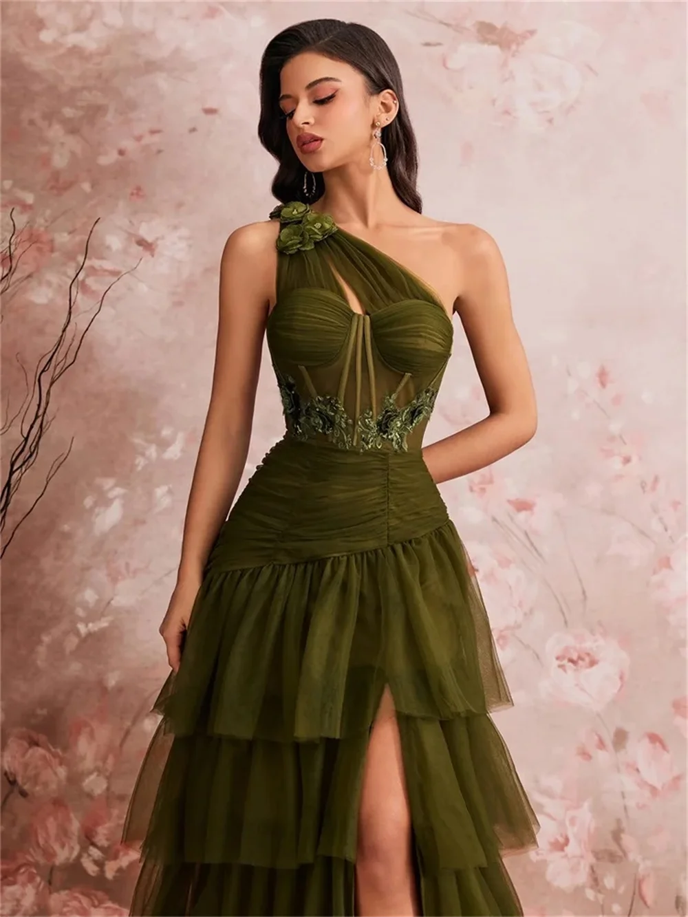 Custom dark green one-shoulder evening gown with layered ruffle tiered skirt and high slit, fitted waist to highlight figure, te
Custom dark green one-shoulder evening gown with layered ruffle tiered skirt and high slit, fitted waist to highlight figure, te