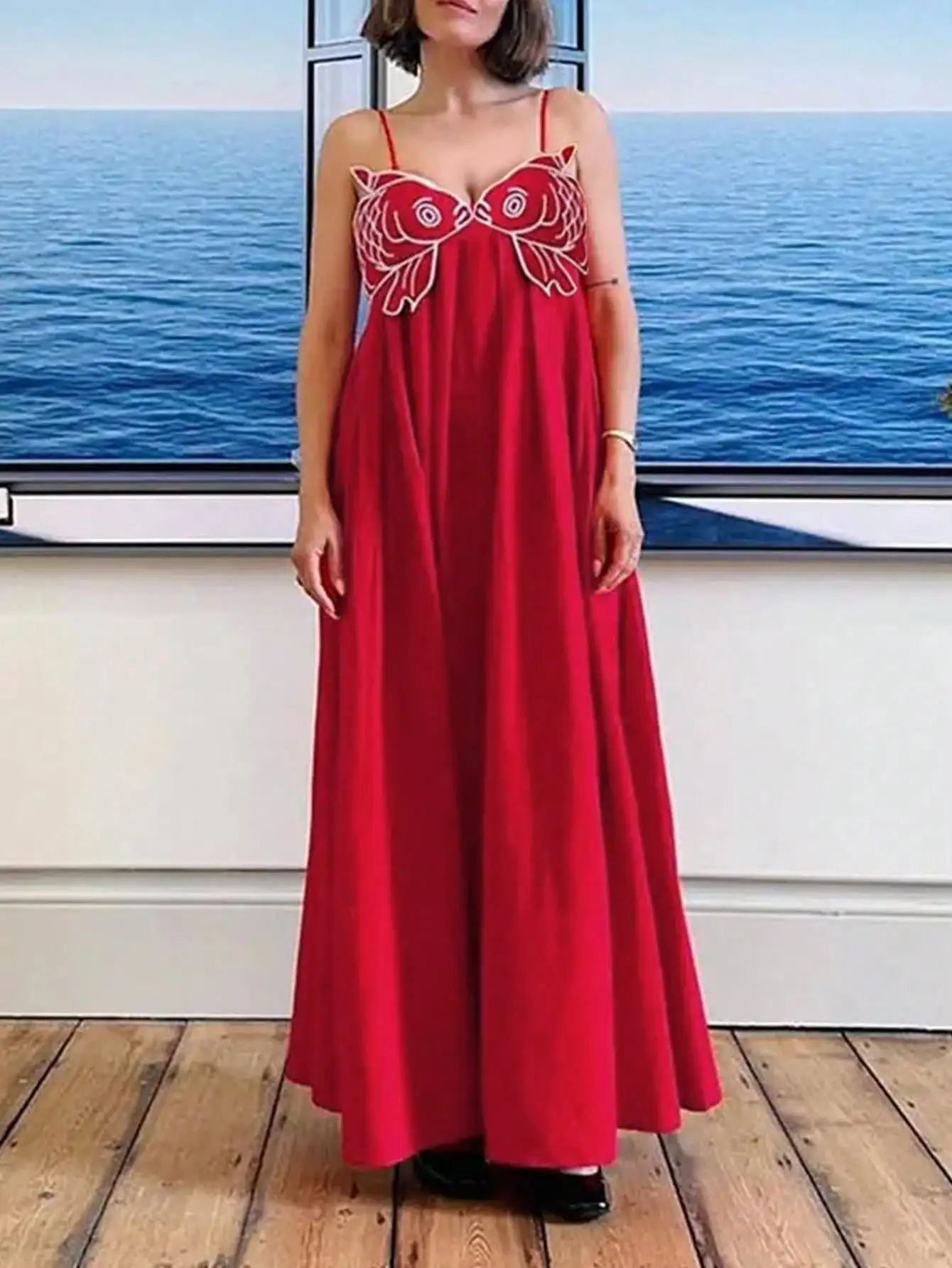 Red Sleeveless A-Line Maxi Dress with Embroidered Fish Motif
Red Sleeveless A-Line Maxi Dress with Embroidered Fish Motif