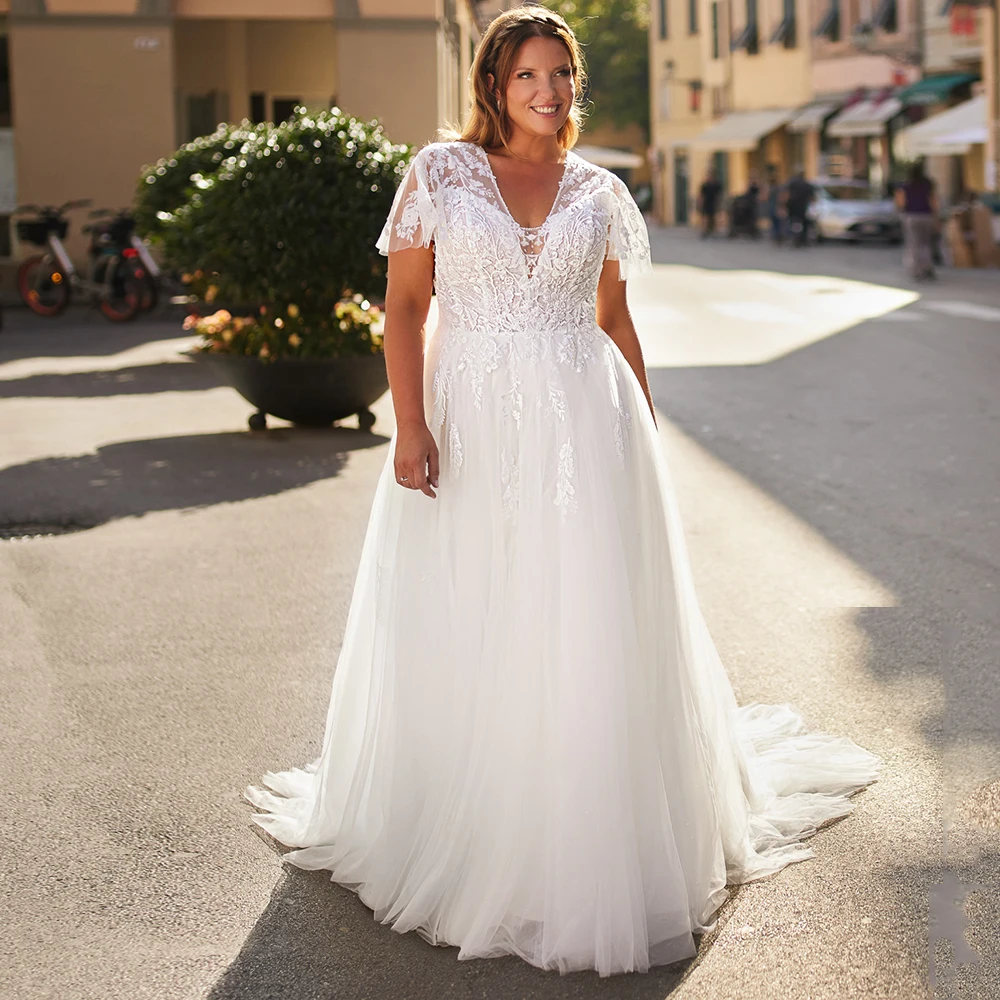 Customized Short Sleeves Appliques Wedding Dress for Woman 2024 Elegant V-Neck Lace Button Back Bridal Gowns with Sweep Train
Customized Short Sleeves Appliques Wedding Dress for Woman 2024 Elegant V-Neck Lace Button Back Bridal Gowns with Sweep Train