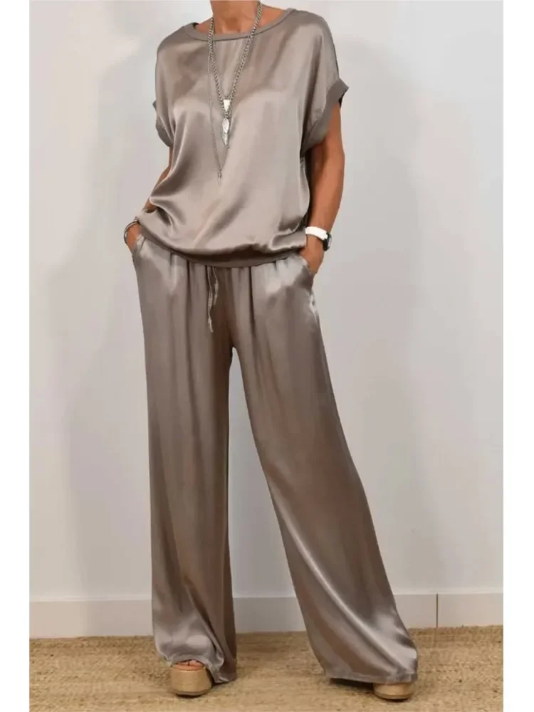 Summer Solid Color Satin 2 Piece Sets Women Outfits O-neck Short Sleeve Tops Lace-up Loose Wide Leg Pant Casual Loose Womens Set
Summer Solid Color Satin 2 Piece Sets Women Outfits O-neck Short Sleeve Tops Lace-up Loose Wide Leg Pant Casual Loose Womens Set