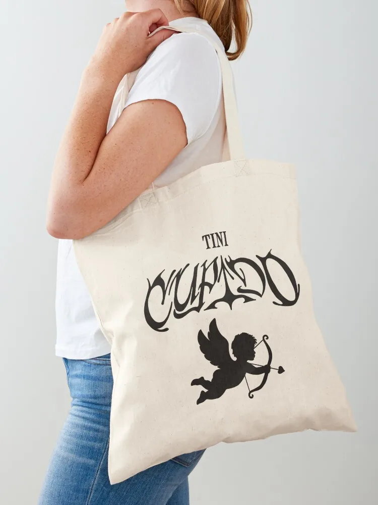 tini stoessel - cupido with an angel (black) Tote Bag Women's handbag custom fabric bag Shopper bag
tini stoessel - cupido with an angel (black) Tote Bag Women's handbag custom fabric bag Shopper bag