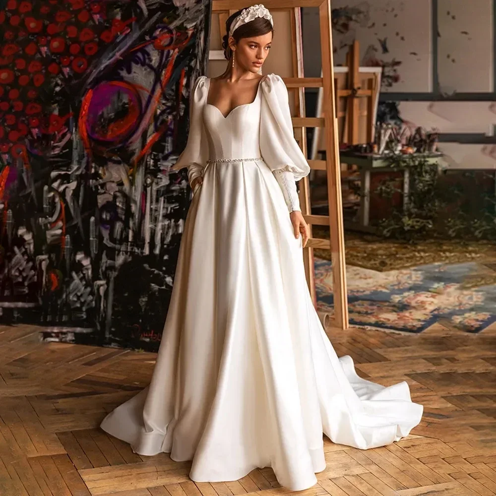 Elegant Puff Sleeves Wedding Dresses A Line Pleats Satin Sweetheart Bridal Gowns With Beads Belt Sexy Backless فستان الزفاف 2024
Elegant Puff Sleeves Wedding Dresses A Line Pleats Satin Sweetheart Bridal Gowns With Beads Belt Sexy Backless فستان الزفاف 2024