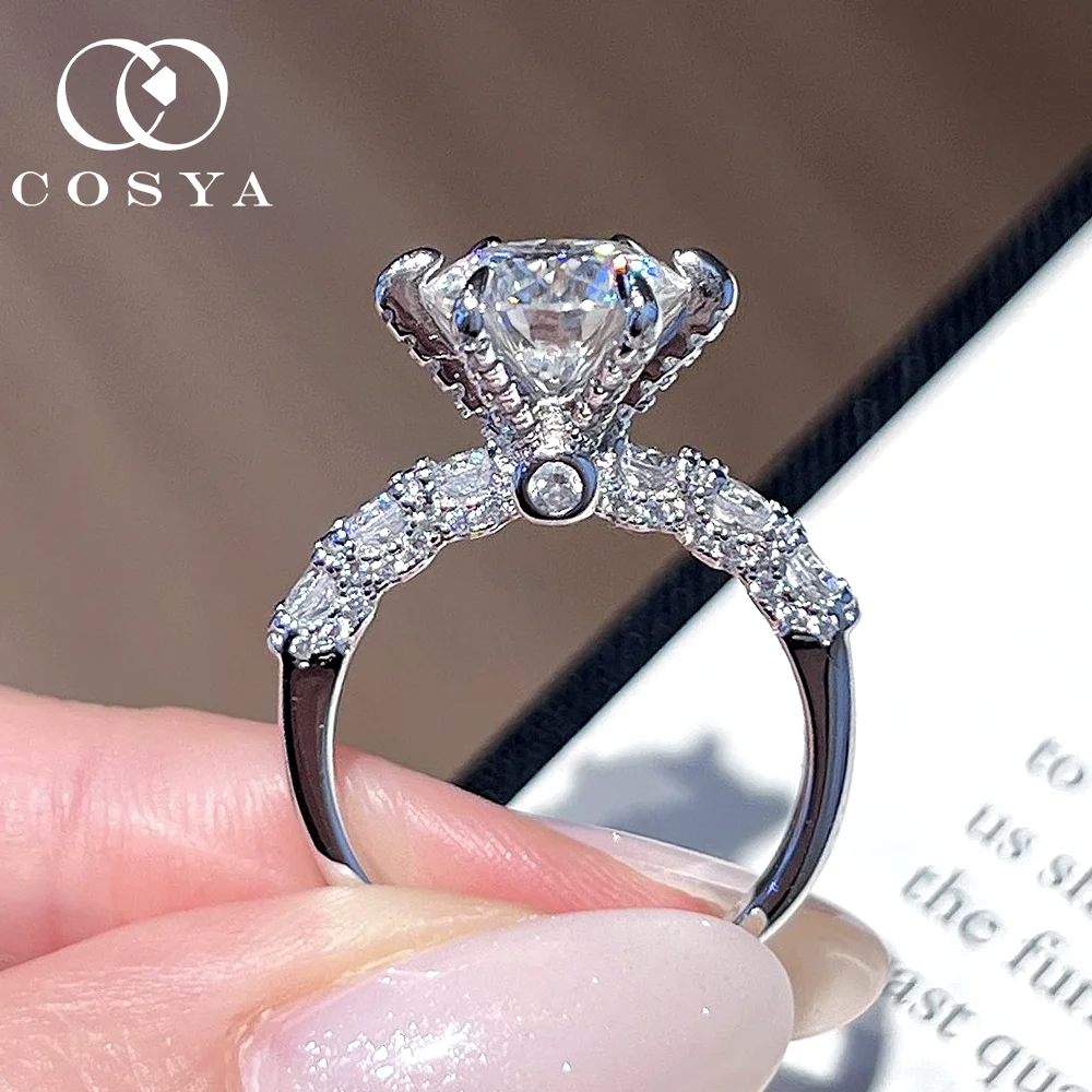 COSYA 3CT 9 мм Кольцо с муассанитом для женщин 100% серебро S925 Сверкающий цвет D VVS1 Lab Diamond Роскошное обручальное кольцо Ювелирные изделия в подарок
COSYA 3CT 9 мм Кольцо с муассанитом для женщин 100% серебро S925 Сверкающий цвет D VVS1 Lab Diamond Роскошное обручальное кольцо Ювелирные изделия в подарок