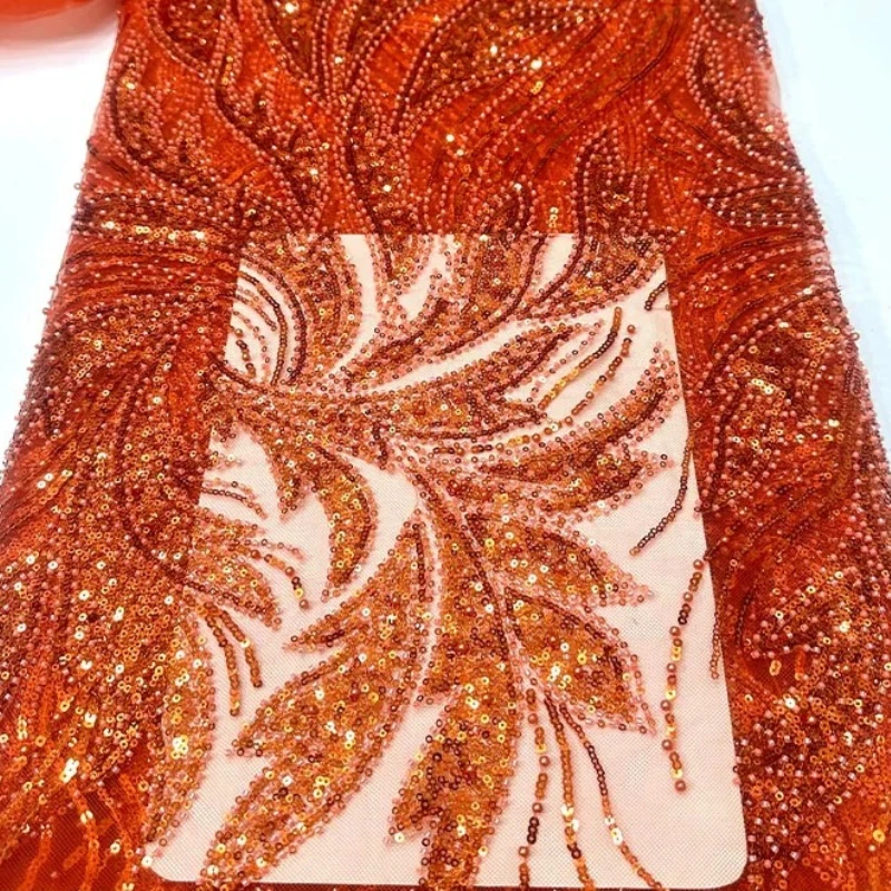 French high-quality beaded net fabric with phoenix feather sequin embroidery for wedding dress and formal wear design.
French high-quality beaded net fabric with phoenix feather sequin embroidery for wedding dress and formal wear design.