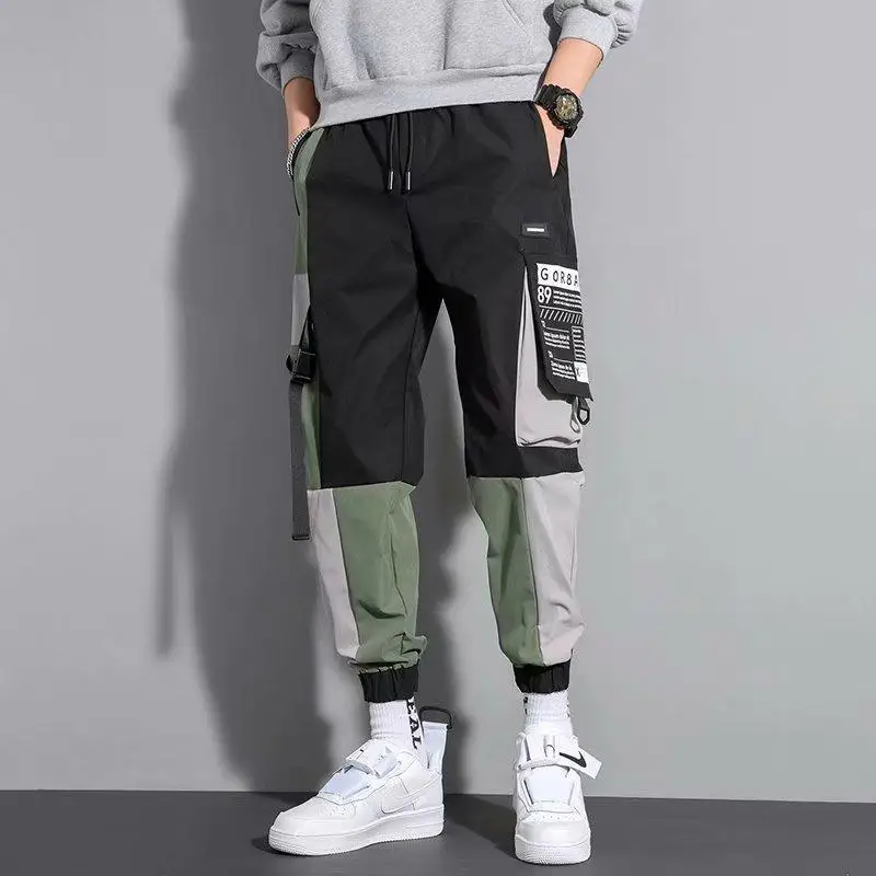 Spring Autumn Korean Fashion Patchwork Loose Casual Cargo Pants Male Pockets Elastic Waist Drawstring Trousers Men's Clothing
Spring Autumn Korean Fashion Patchwork Loose Casual Cargo Pants Male Pockets Elastic Waist Drawstring Trousers Men's Clothing