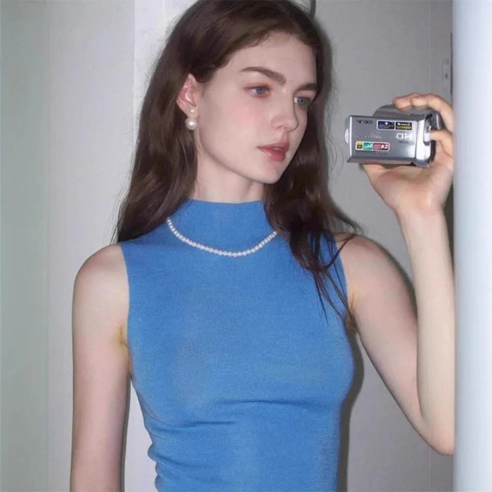 2026 Summer French Style Women Blue Mock Neck Knit Vest Slim Fit Crop Sleeveless Tank Tops For Inner And Outer Wear
2026 Summer French Style Women Blue Mock Neck Knit Vest Slim Fit Crop Sleeveless Tank Tops For Inner And Outer Wear