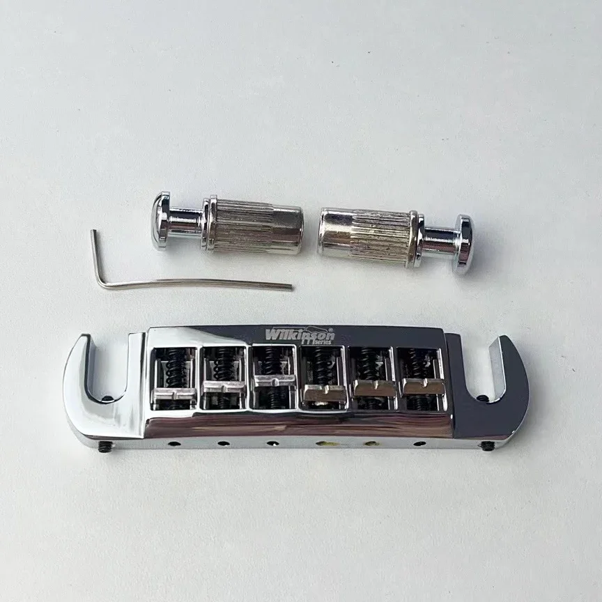 Wilkinson Electric Guitar Bridge Tailpiece WOGT3 Chrome Silver Adjustable Wraparound
Wilkinson Electric Guitar Bridge Tailpiece WOGT3 Chrome Silver Adjustable Wraparound