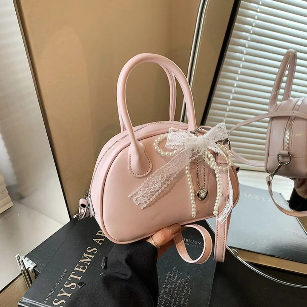 Sweet Bowling Shoulder Bag with Pearl Pendant PU Leather Boston Crossbody Bag Solid Color Korean Style Pillow Handbag Streetwear
Sweet Bowling Shoulder Bag with Pearl Pendant PU Leather Boston Crossbody Bag Solid Color Korean Style Pillow Handbag Streetwear