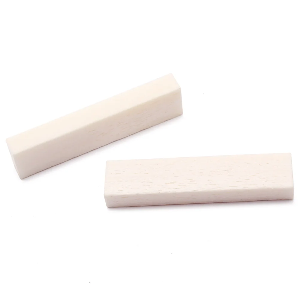 5Pcs DIY Buffalo Bone Saddle Nut Replacement for Acoustic Guitar Ukulele Banjo String Instrument 39x9x5mm Guitar Bone Parts 
5Pcs DIY Buffalo Bone Saddle Nut Replacement for Acoustic Guitar Ukulele Banjo String Instrument 39x9x5mm Guitar Bone Parts