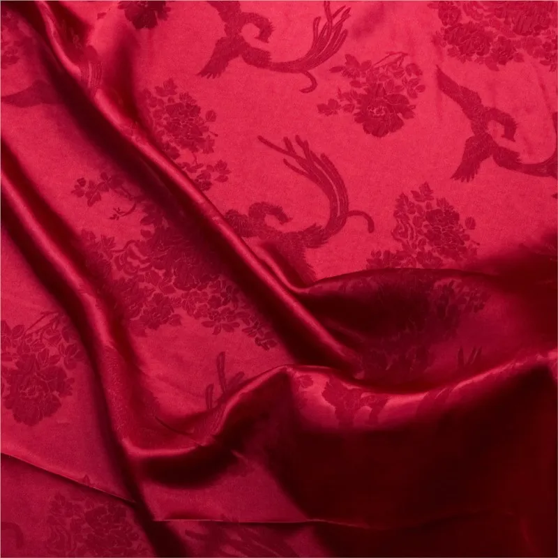 A new Chinese-style cheongsam fabric with bright red jacquard silk stretch satin and crepe
A new Chinese-style cheongsam fabric with bright red jacquard silk stretch satin and crepe
