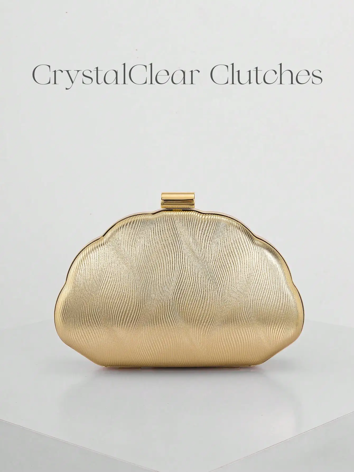 Gold Textured Shell-Shaped Clutch Bag with Metal Frame Closure
Gold Textured Shell-Shaped Clutch Bag with Metal Frame Closure