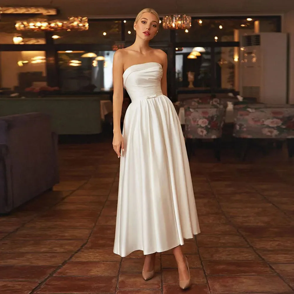 Sexy Tea Length Wedding Dress A Line Silk Satin Bride Dress Simple Bridal Gown Women Pockets Lace Up Customized Wedding Gown
Sexy Tea Length Wedding Dress A Line Silk Satin Bride Dress Simple Bridal Gown Women Pockets Lace Up Customized Wedding Gown