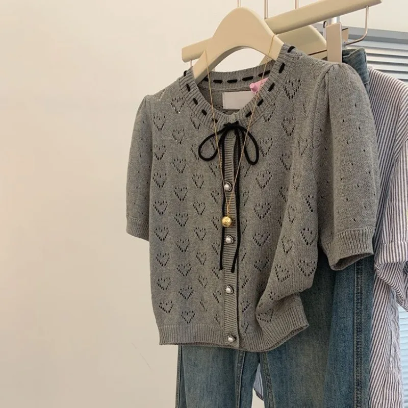 Vintage Elegant O-neck Lace Up Summer Thin Hollow Out Knitted Tops Women's Elegant Loose Short Sleeve Casual Solid Cardigan
Vintage Elegant O-neck Lace Up Summer Thin Hollow Out Knitted Tops Women's Elegant Loose Short Sleeve Casual Solid Cardigan