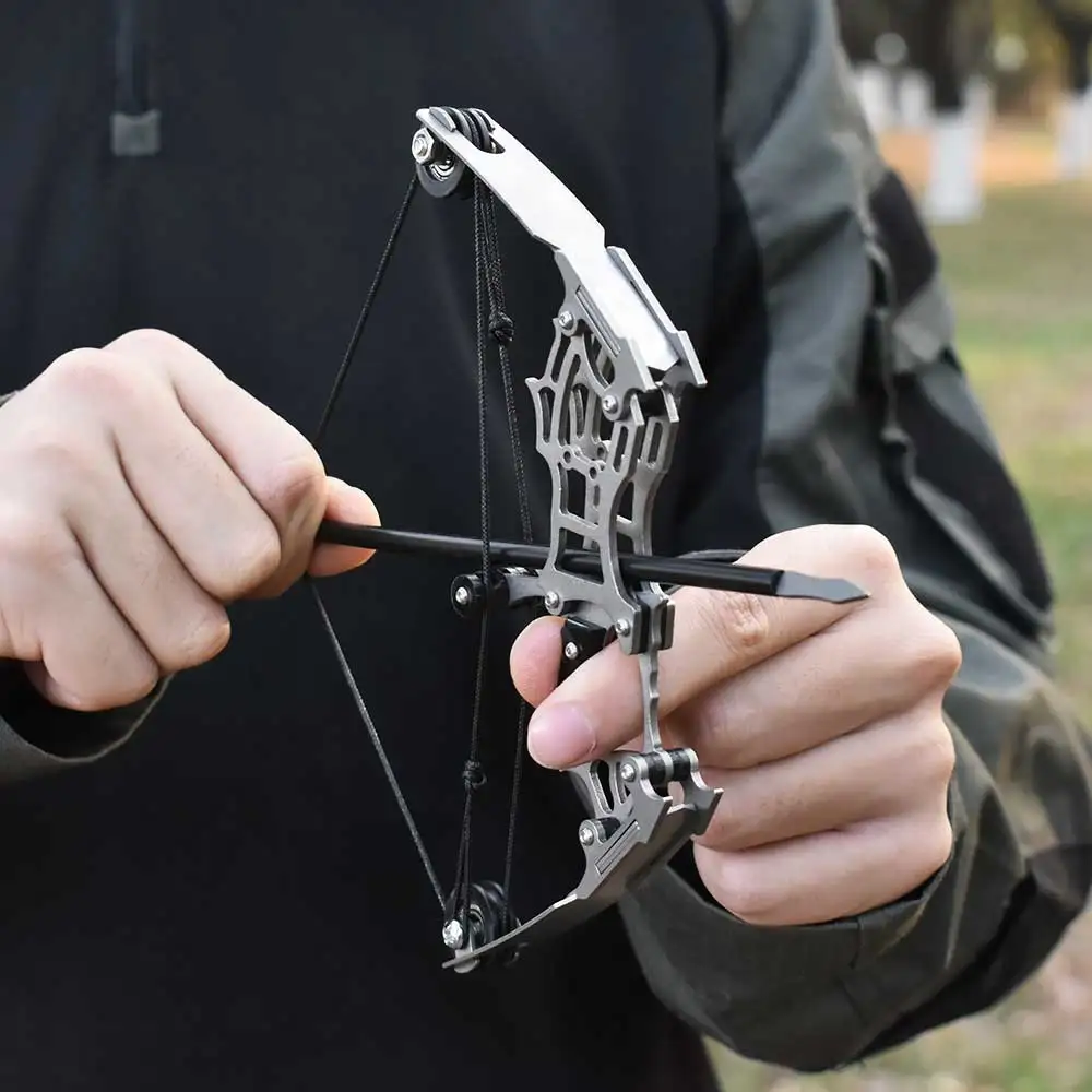 18cm Metal Silver Mini Bow Bow Hunting Shooting Portable Equipment Small Palm Compound Bow Toy Outdoor Toy
18cm Metal Silver Mini Bow Bow Hunting Shooting Portable Equipment Small Palm Compound Bow Toy Outdoor Toy