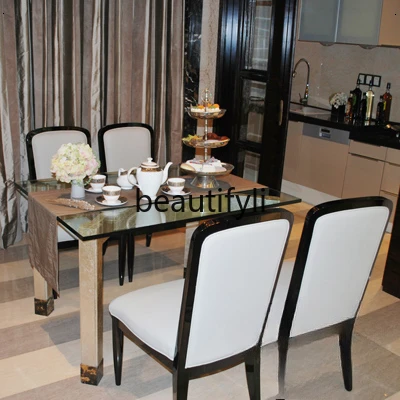 Glass dining table, champagne color, post-modern 1.2-meter small dining table
Glass dining table, champagne color, post-modern 1.2-meter small dining table