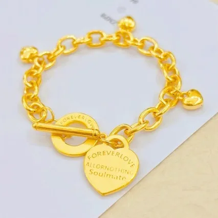 Heart Shaped Bracelet for Women, 24K Gold, AU999 | Smooth golden heart on elastic cord, sweet simplicity with love symbolism.
Heart Shaped Bracelet for Women, 24K Gold, AU999 | Smooth golden heart on elastic cord, sweet simplicity with love symbolism.