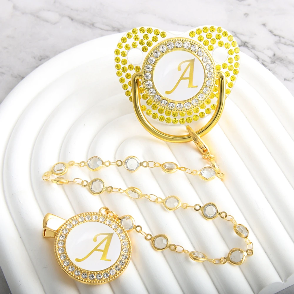 26 Initial Letters with Diamond Clear Baby Pacifier With Bead Chain Clip Gold Nipple
26 Initial Letters with Diamond Clear Baby Pacifier With Bead Chain Clip Gold Nipple