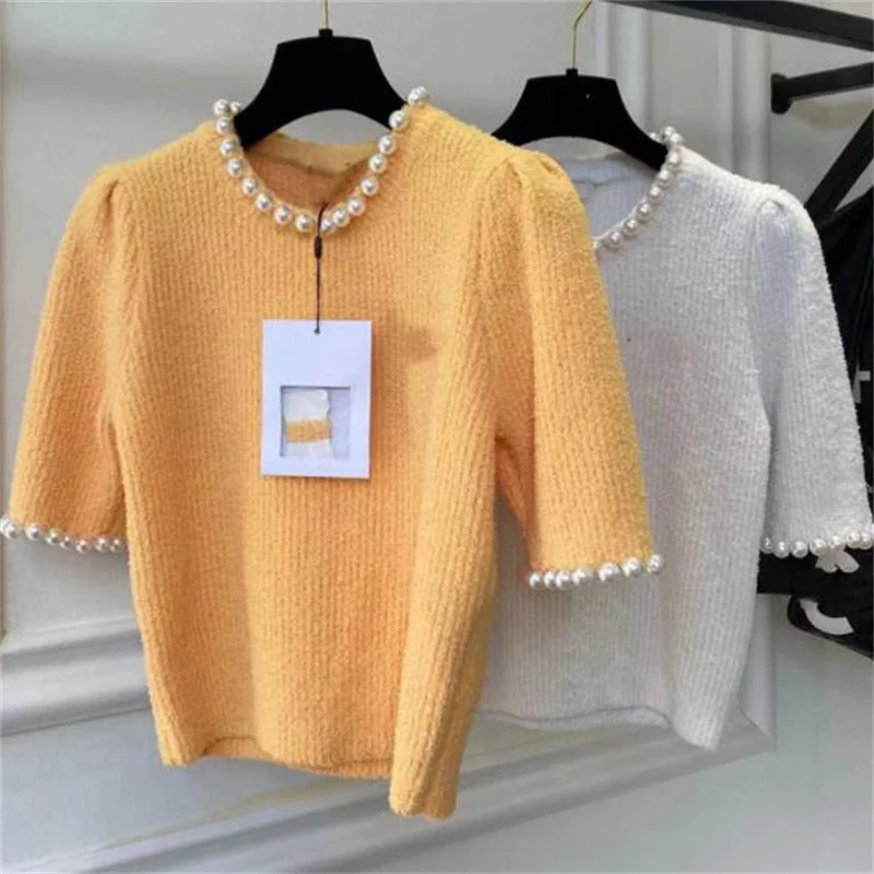Round neck pullover pearl top women's spring and summer puff sleeves knitted shirt
Round neck pullover pearl top women's spring and summer puff sleeves knitted shirt