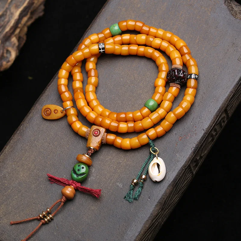 108-bead Tibetan-style camel bone and large intestine mala, with Vajra Bodhi seeds and a cat-themed antique three-way connector
108-bead Tibetan-style camel bone and large intestine mala, with Vajra Bodhi seeds and a cat-themed antique three-way connector