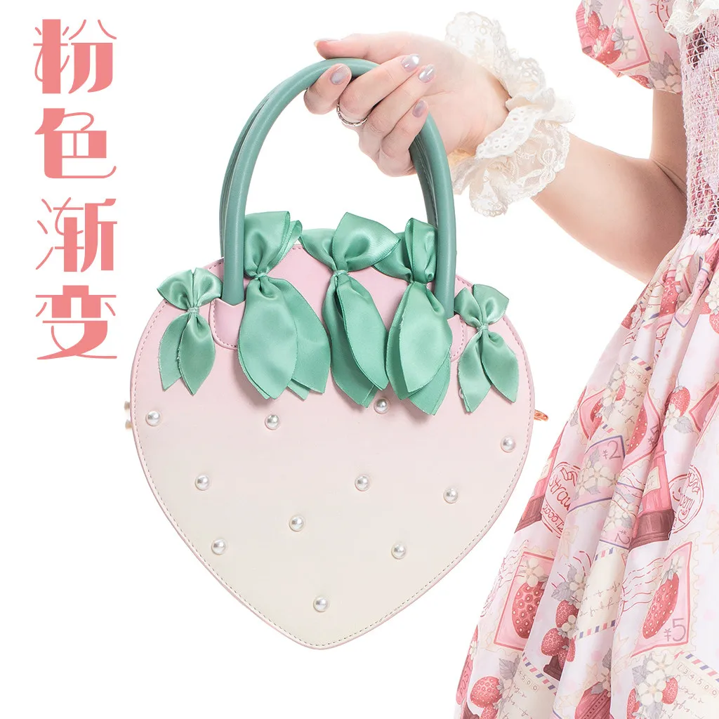 Оригинальная сумка Sweet Lolita в форме клубники, женская сумка с жемчужным декором и бантом, сумка через плечо
Оригинальная сумка Sweet Lolita в форме клубники, женская сумка с жемчужным декором и бантом, сумка через плечо