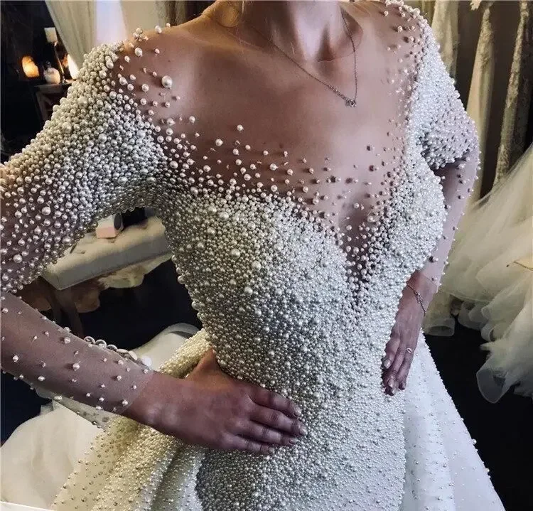 Customized High-end Pearl Heavy Beaded Long Sleeve Wedding Dresses Dubai Wedding Gowns With Detachable Tail
Customized High-end Pearl Heavy Beaded Long Sleeve Wedding Dresses Dubai Wedding Gowns With Detachable Tail
