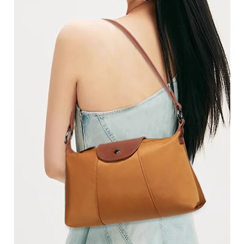Small square bag women's nylon shoulder underarm bag dumpling bag niche design simple fashion messenger bag
Small square bag women's nylon shoulder underarm bag dumpling bag niche design simple fashion messenger bag