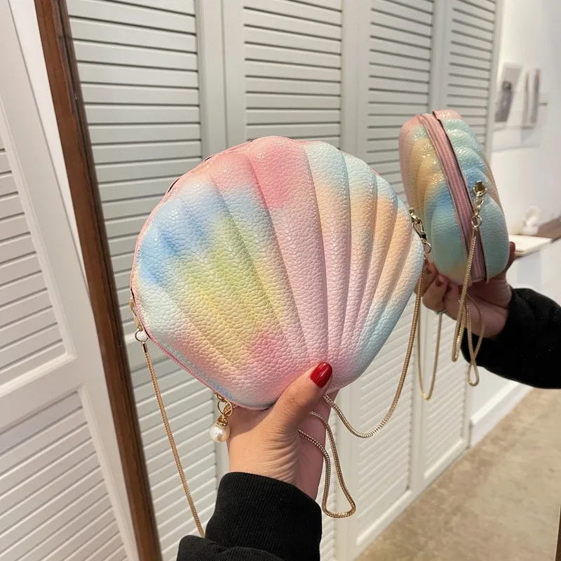 Shell-wrapped Handheld Colorful Niche Design Small Bag for Women 2026 New Fashionable Autumn Chain Messenger Bag
Shell-wrapped Handheld Colorful Niche Design Small Bag for Women 2026 New Fashionable Autumn Chain Messenger Bag