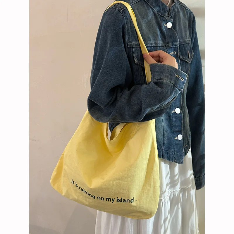 Korean Lazy Style Double-sided Letter Canvas Bag New Large-capacity Commuter Tote Bag Niche Shoulder Messenger Bag 
Korean Lazy Style Double-sided Letter Canvas Bag New Large-capacity Commuter Tote Bag Niche Shoulder Messenger Bag