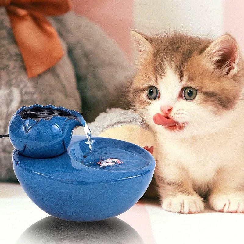 Ceramic pet water fountain with USB pump for cats and other pets to drink water.
Ceramic pet water fountain with USB pump for cats and other pets to drink water.