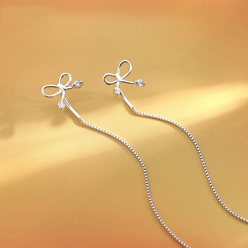 Real 925 Sterling Silver Zircon Hollow Bowknot Tassel Chain Drop Earrings for Women Cute Fine Jewelry Minimalist Accessories
Real 925 Sterling Silver Zircon Hollow Bowknot Tassel Chain Drop Earrings for Women Cute Fine Jewelry Minimalist Accessories