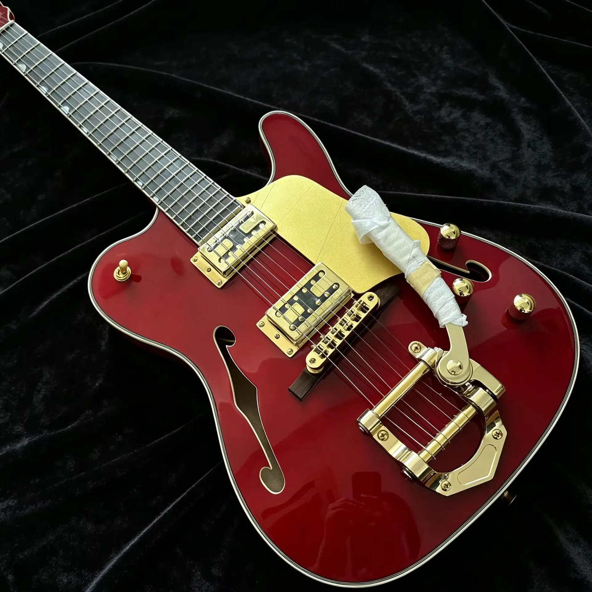 Custom red electric guitar with a semi-hollow body and F-shaped soundhole. Rosewood fingerboard 22 fret positions, 6 strings
Custom red electric guitar with a semi-hollow body and F-shaped soundhole. Rosewood fingerboard 22 fret positions, 6 strings