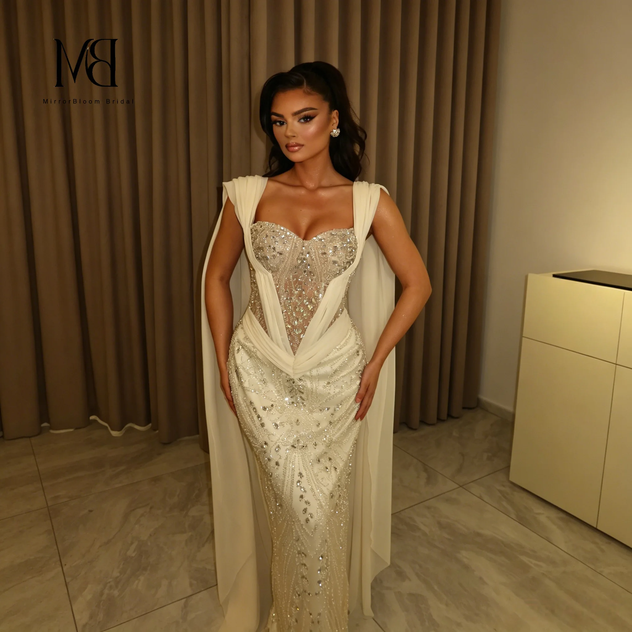 White Strapless Off-Shoulder Sleeveless Floor Length Mermaid Formal Gown with Beaded Sash and Matching Floor Length Shawl
White Strapless Off-Shoulder Sleeveless Floor Length Mermaid Formal Gown with Beaded Sash and Matching Floor Length Shawl