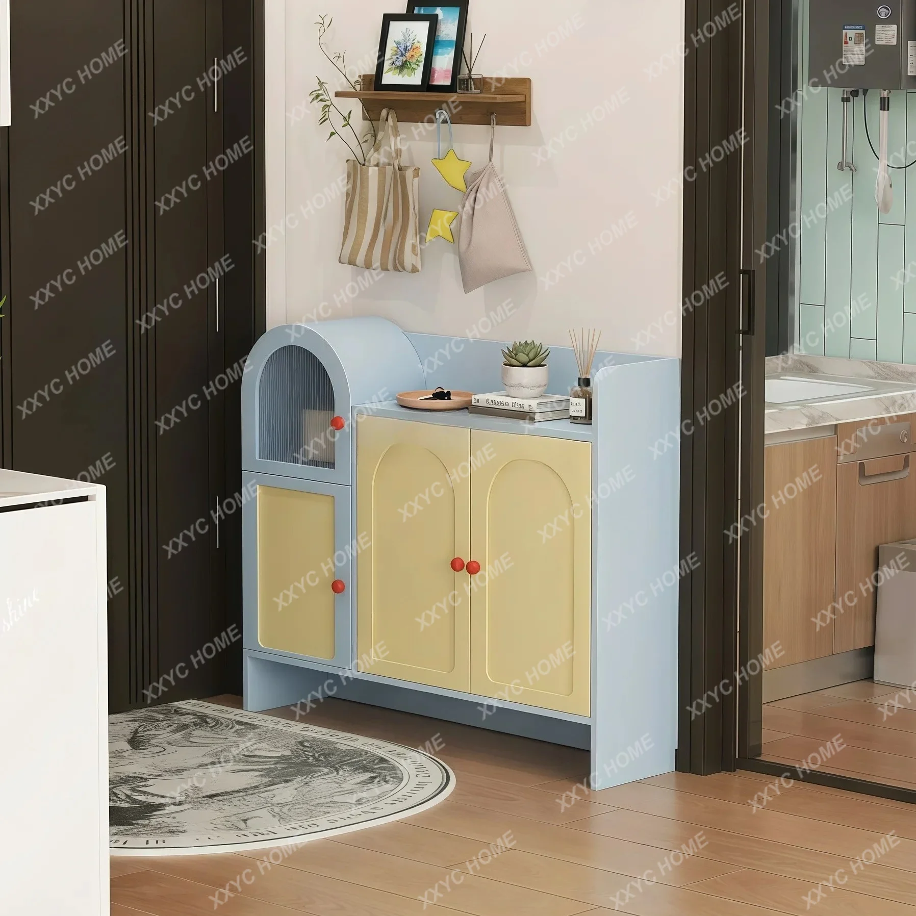 Lentrance to the home is integrated with the entrance cabinet against the wall and storage locker outside
Lentrance to the home is integrated with the entrance cabinet against the wall and storage locker outside
