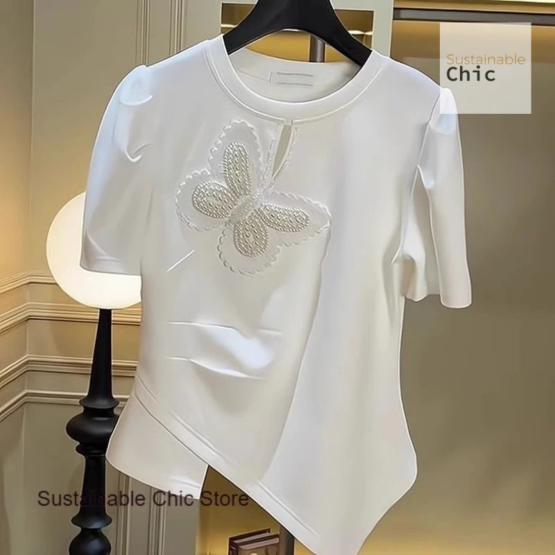 French style white round neck butterfly studded irregular short-sleeved T-shirt female summer fashion Joker temperament top.
French style white round neck butterfly studded irregular short-sleeved T-shirt female summer fashion Joker temperament top.