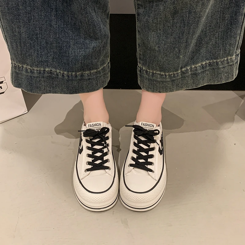 Stylish canvas shoes in colors like pink, black white, with classic lacing—simple, trendy, perfect for daily wear, adding casual
Stylish canvas shoes in colors like pink, black white, with classic lacing—simple, trendy, perfect for daily wear, adding casual