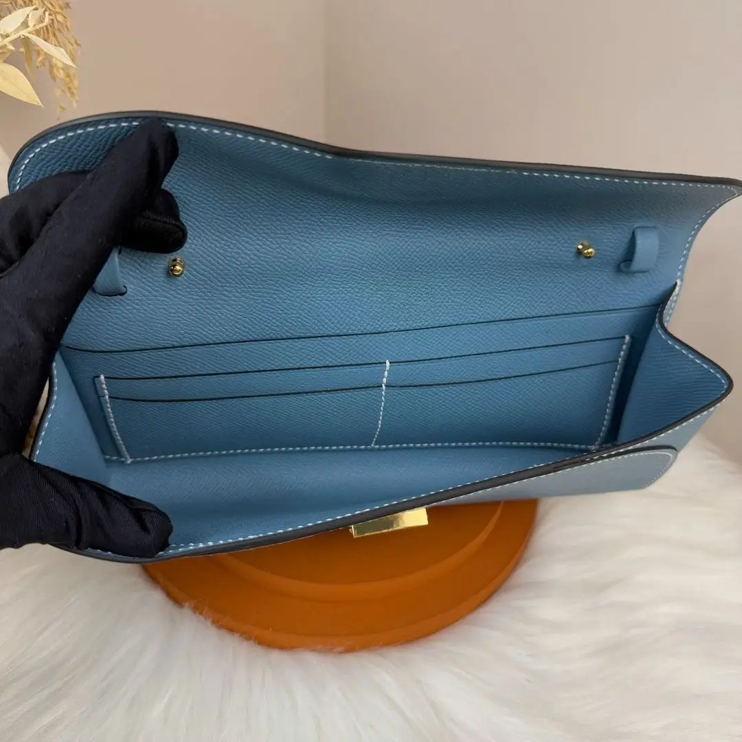 Women's 2-in-1 blue grained leather envelope clutch/crossbody bag, simple flap wallet.
Women's 2-in-1 blue grained leather envelope clutch/crossbody bag, simple flap wallet.