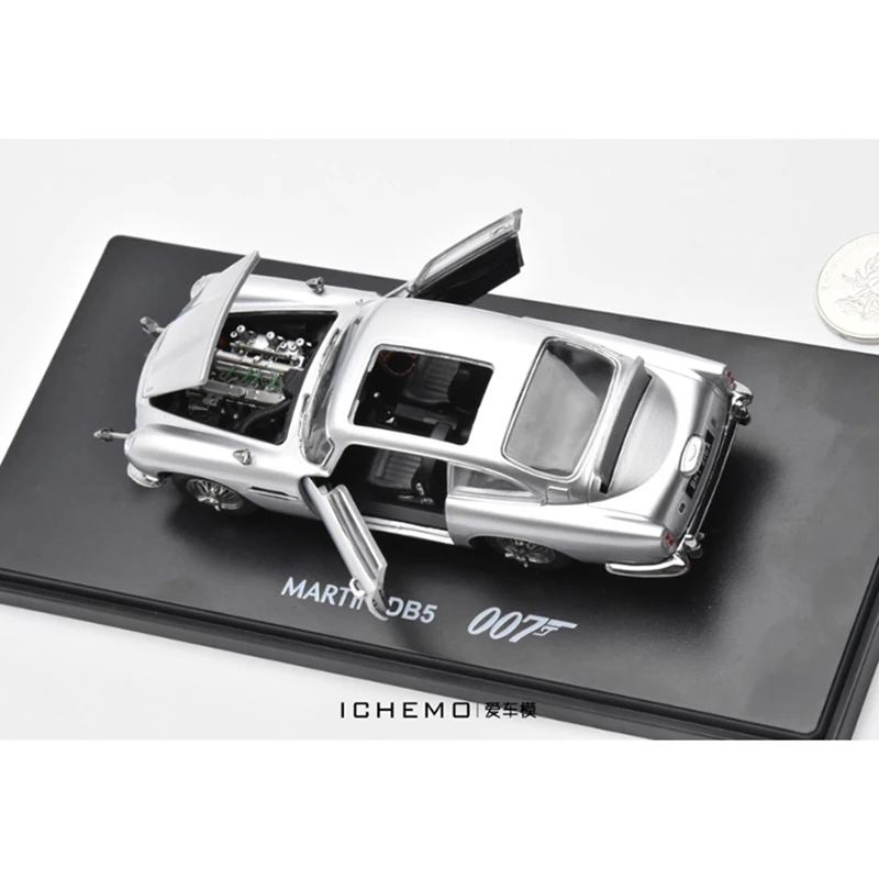 Литой под давлением масштаб 1:43, DB5 007 с куклой, модель автомобиля из сплава, готовая коллекция имитаций, украшение, подарочный дисплей
Литой под давлением масштаб 1:43, DB5 007 с куклой, модель автомобиля из сплава, готовая коллекция имитаций, украшение, подарочный дисплей