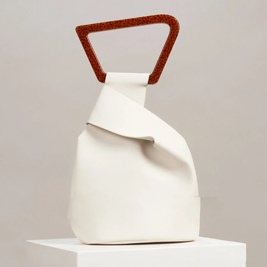 Simple irregular design clutch bag summer new pu leather bucket bag female fashion personality acrylic handle handbag solid tote
Simple irregular design clutch bag summer new pu leather bucket bag female fashion personality acrylic handle handbag solid tote