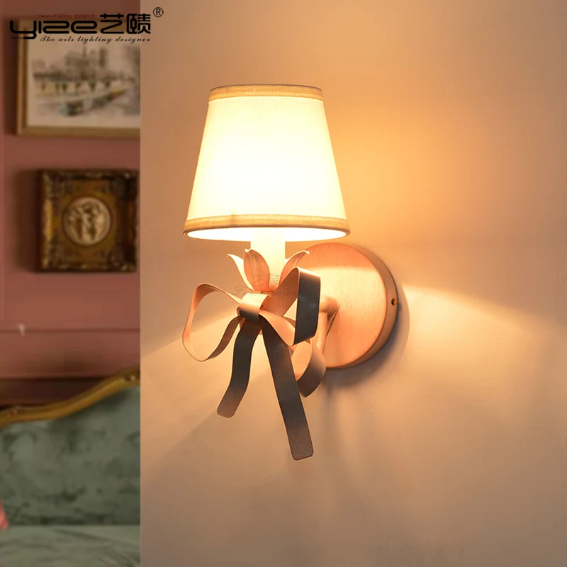 Nordic princess children's room wall lamp creative wrought iron pink bow background wall
Nordic princess children's room wall lamp creative wrought iron pink bow background wall