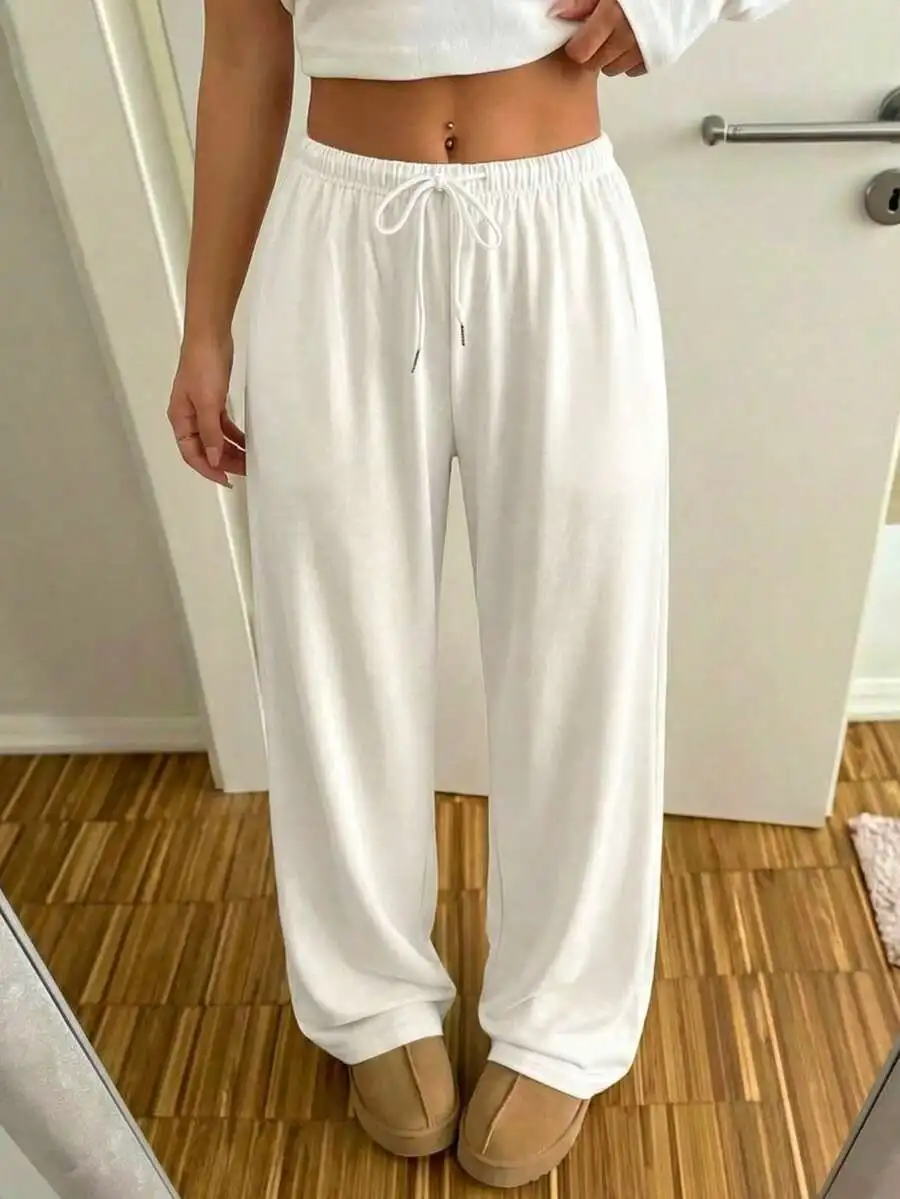 Женские однотонные спортивные брюки с широкими штанинами и завязками на талии для повседневной носки
Женские однотонные спортивные брюки с широкими штанинами и завязками на талии для повседневной носки