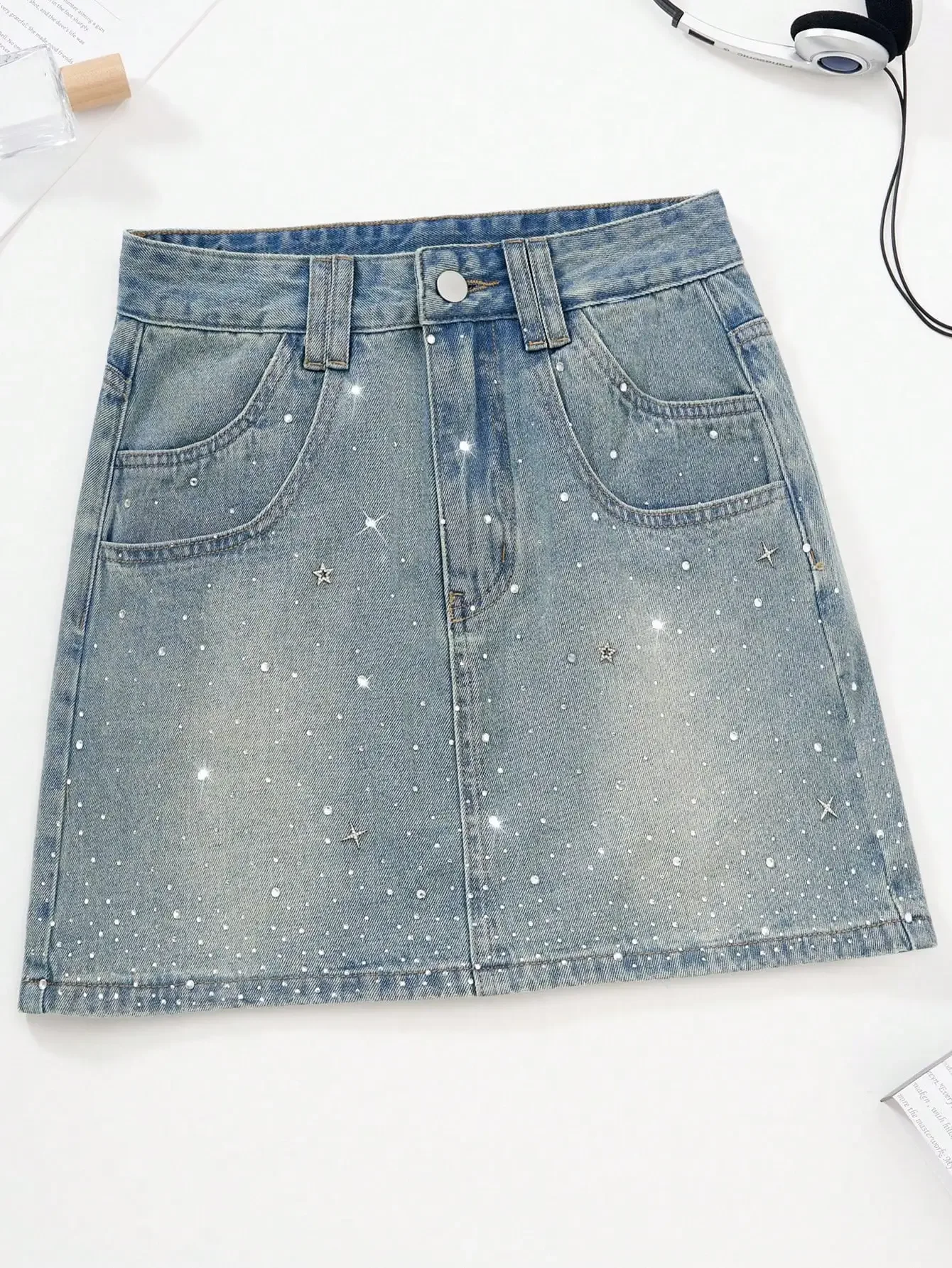 Women's Distressed Denim Mini Skirt with Star & Dot Rhinestone Embellishments
Women's Distressed Denim Mini Skirt with Star & Dot Rhinestone Embellishments