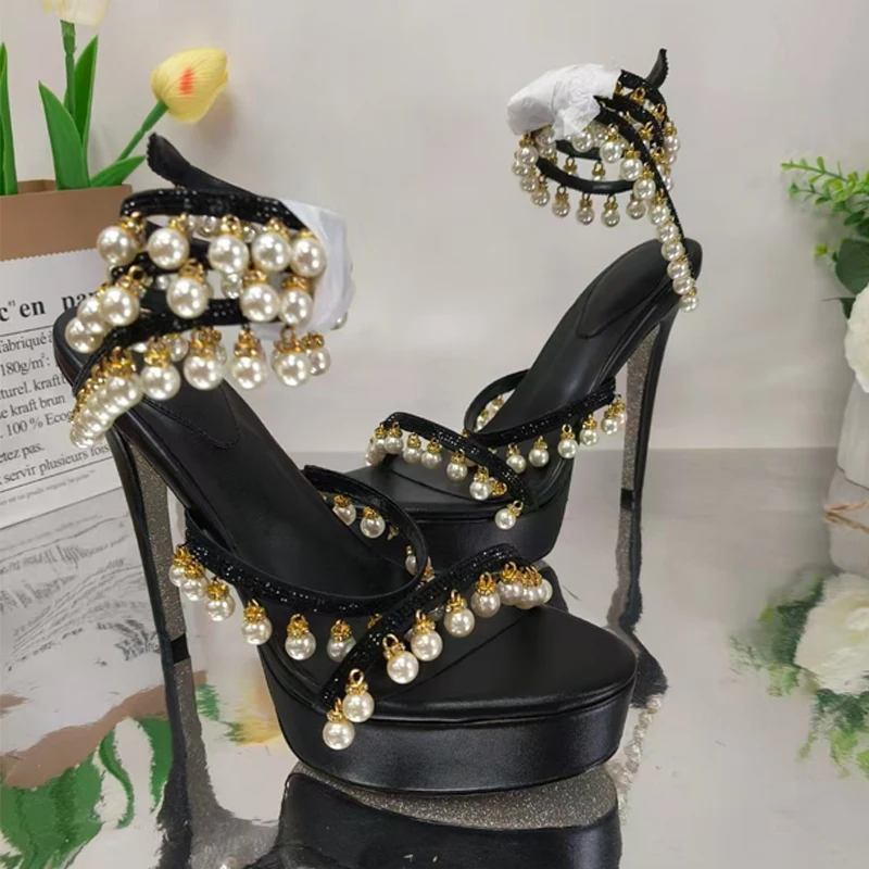 Round Open-Toe Pearl Pendant Snake Winding Stiletto Sandals Woman Summer 2025 Rhinestone Platform Slingback High-Heel Shoes
Round Open-Toe Pearl Pendant Snake Winding Stiletto Sandals Woman Summer 2025 Rhinestone Platform Slingback High-Heel Shoes