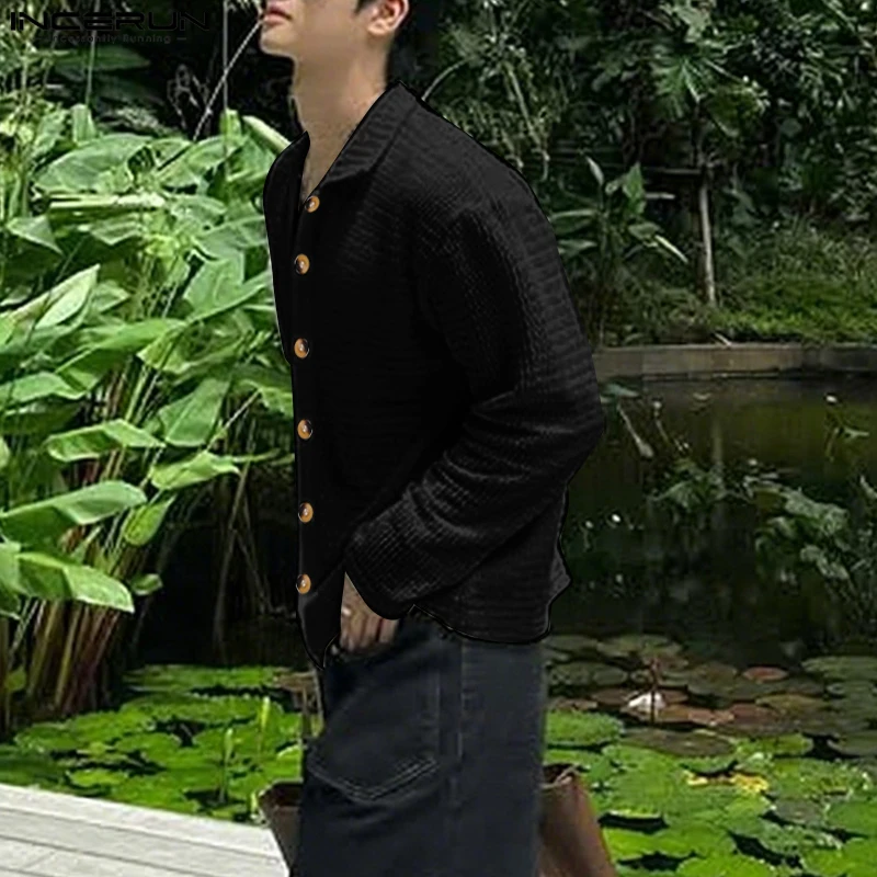 INCERUN Мужская рубашка с вырезами, прозрачная однотонная мужская одежда с лацканами и длинными рукавами, уличная одежда, свободные модные повседневные топы 2025 года
INCERUN Мужская рубашка с вырезами, прозрачная однотонная мужская одежда с лацканами и длинными рукавами, уличная одежда, свободные модные повседневные топы 2025 года