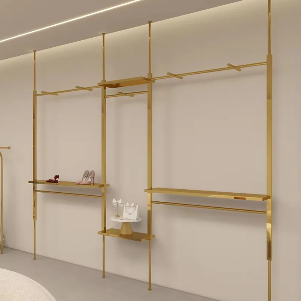 Изготовленная на заказ блестящая золотая подставка для одежды из нержавеющей стали, сверхмощный магазин одежды, металлическая витрина, напольные стеллажи для демонстрации одежды
Изготовленная на заказ блестящая золотая подставка для одежды из нержавеющей стали, сверхмощный магазин одежды, металлическая витрина, напольные стеллажи для демонстрации одежды