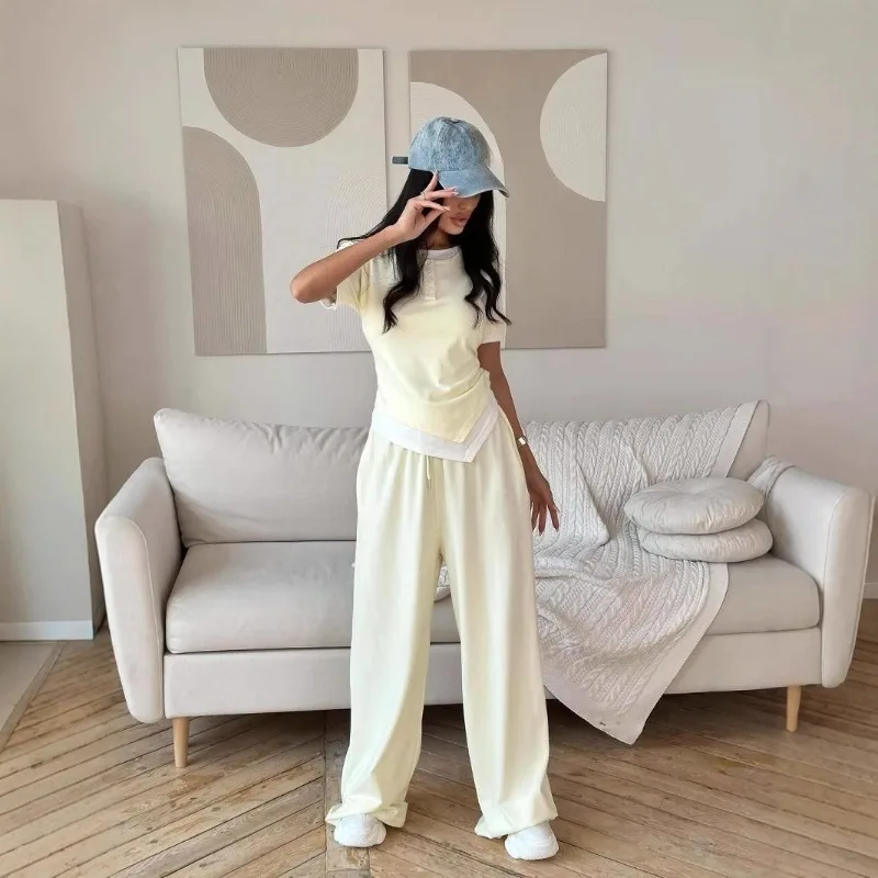 The New Summer Short-sleeved Set Features Two Slimming, Waist-buttoned Design T-shirts and Straight-leg Casual Trousers Fashion
The New Summer Short-sleeved Set Features Two Slimming, Waist-buttoned Design T-shirts and Straight-leg Casual Trousers Fashion