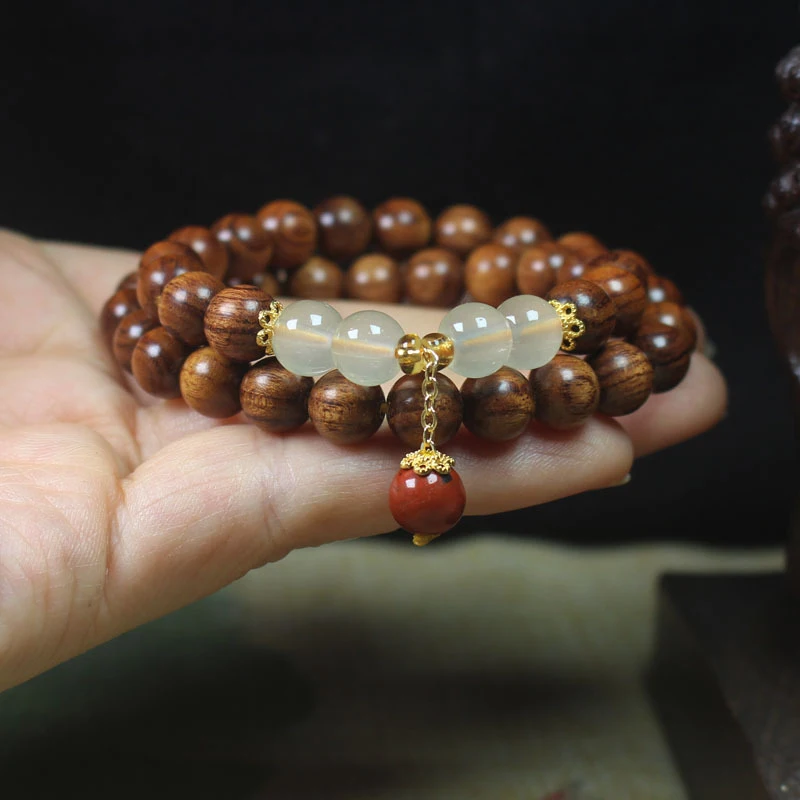 Large-leaf yellow rosewood double-circle bracelet with cinnabar pendant, Buddhist prayer beads and ornaments
Large-leaf yellow rosewood double-circle bracelet with cinnabar pendant, Buddhist prayer beads and ornaments