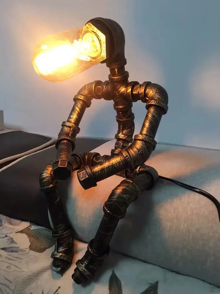 Loft Robot Table Lamp Creative American Iron Pipe Eye Protection Industrial Style Coffee Bar Bedroom Study Desk Lamp
Loft Robot Table Lamp Creative American Iron Pipe Eye Protection Industrial Style Coffee Bar Bedroom Study Desk Lamp